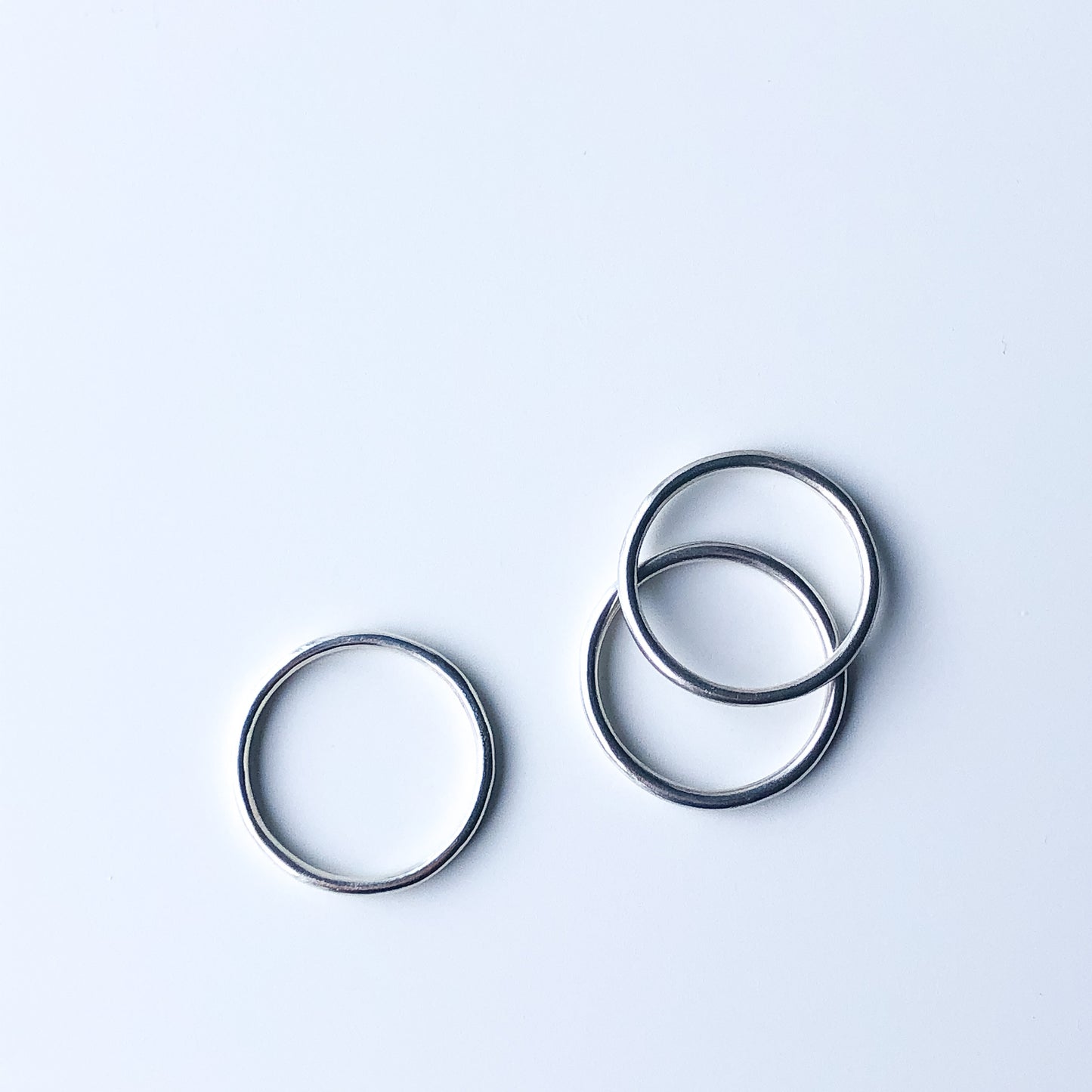 Three plain silver stacking rings