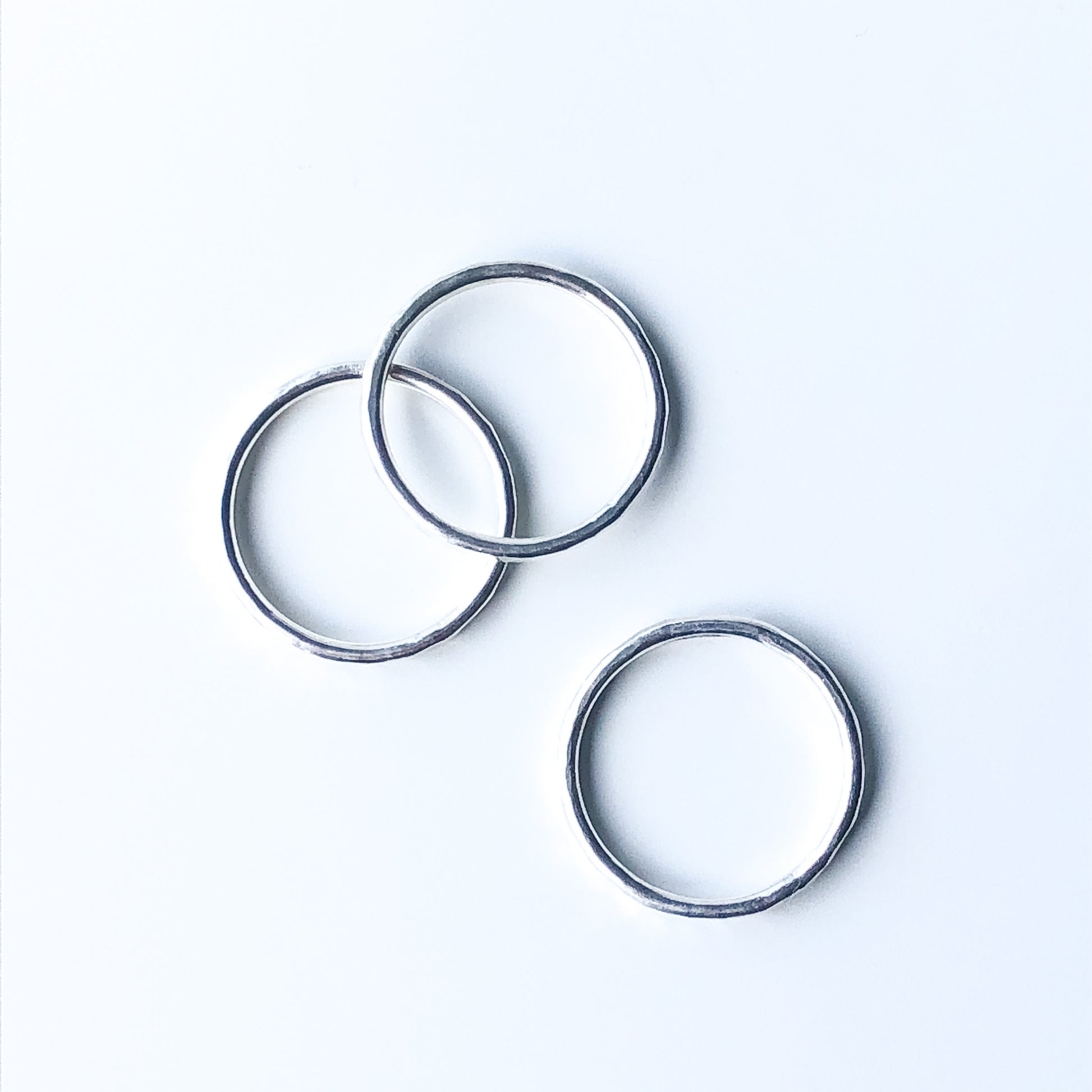 Top view of three hammered texture stacking rings