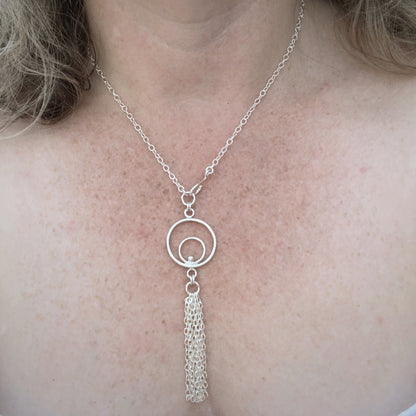 Orbital tassel necklace on model