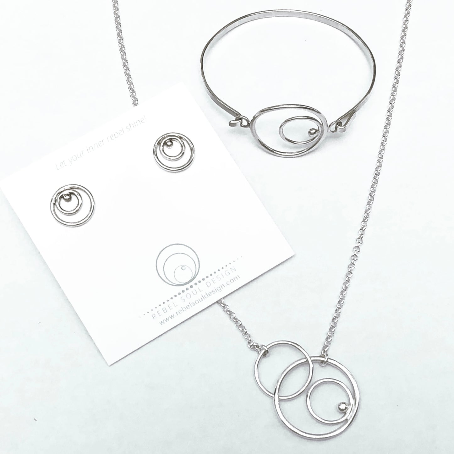Orbital linked necklace with coordinating earrings and bracelet