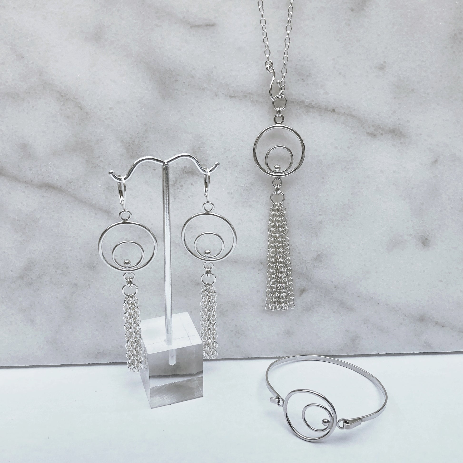 Orbital fringe earrings necklace and bracelet