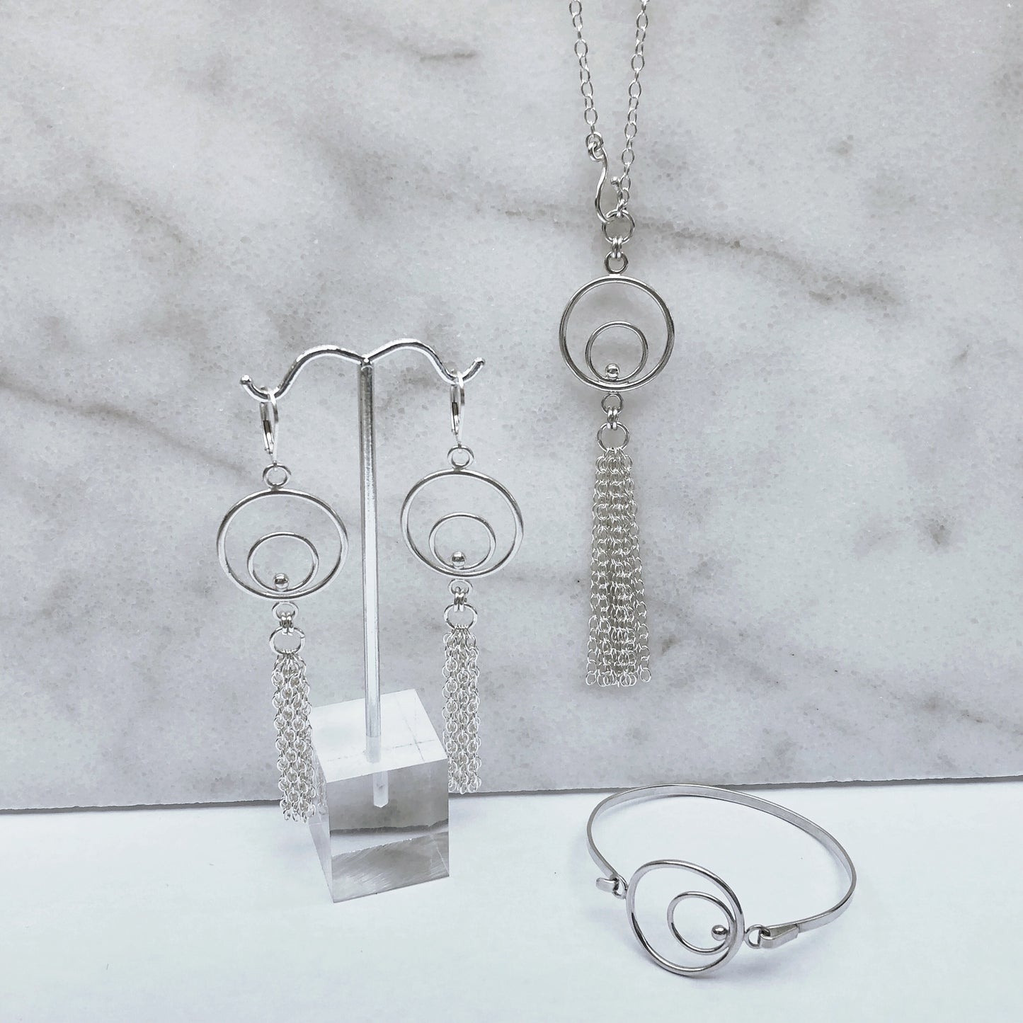 silver tassel necklace earrings and bracelet